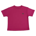 Pink t-shirt with a small green logo