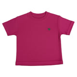 Pink t-shirt with a small green logo